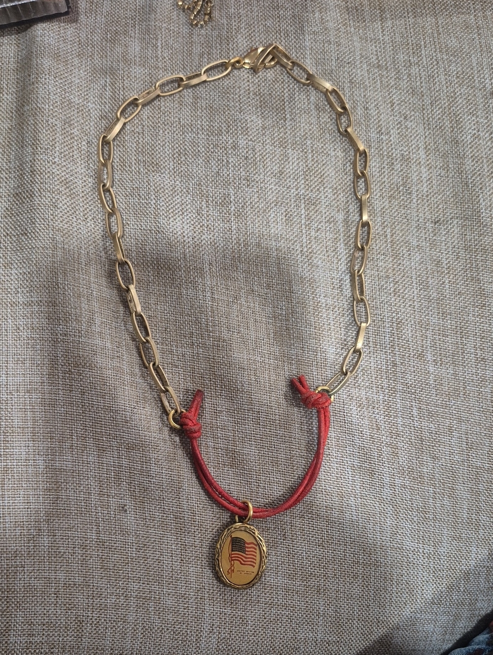 Maximal Art Gold Link Necklace with Red Cord and Flag Medallion